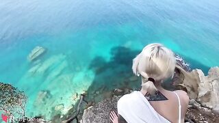 A cute girl passionately sucks dick on the ocean shore