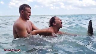 A young couple enjoys an intense and passionate sex session in the blue lagoon