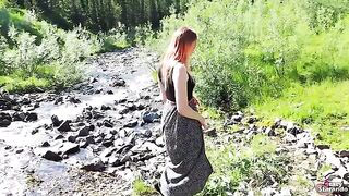 A cheerful teenage girl in red hair seduces a guy and fucks with him outdoors