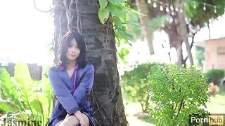 Asian girl masturbates with dildo and vibrator in the garden