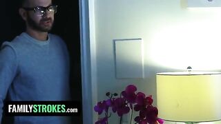 The stepdaughter, in red underwear, pleases her stepfather while her stepmom is in the room