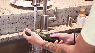 The girl got her pussy wet with a big dildo in the kitchen