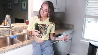 The girl got her pussy wet with a big dildo in the kitchen