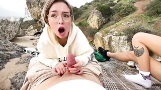 Two young girls enjoy sex on the beach during their vacation