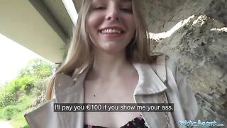 A young beautiful Ukrainian has long hair and she is talking to a stranger