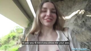 A young beautiful Ukrainian has long hair and she is talking to a stranger