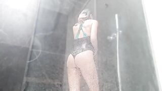 The girl came to the shower and began to masturbate her pussy