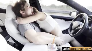 A young cute chick fucks with a guy in his car while driving
