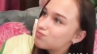 An adult man fucks a sexy young girl with small boobs on the couch