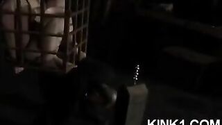 A slave in a cage fulfills all the orders of his master
