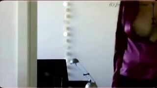 The guy shoots his cock from behind the big tits