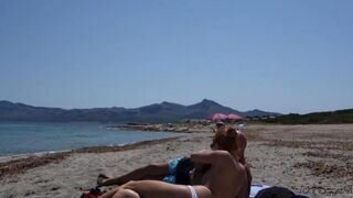 Blowjob on the beach with an unfamiliar guy in glasses