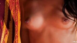 A chick with pierced nipples playing with her cunt
