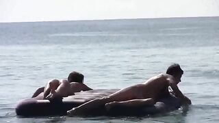 A tan beauty got naked on the beach and showed her boobs