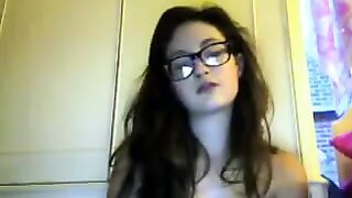 A student with glasses gets undressed during a video call