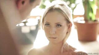 A sexy blonde in a red dress rides her husband’s cock on horseback
