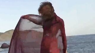 A sexy girl with small boobs gets wet in the rain