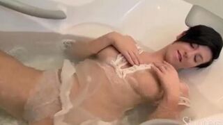 Brunette solo masturbation in the shower with a water jet
