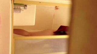 A girl has sex in the shower and is being filmed