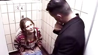 A hot chick has sex in the toilet booth of the club at night