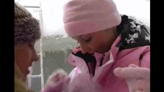 Lesbians have fun in the snow on a cold winter day