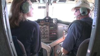 A flight attendant is having sex with a passenger on a plane