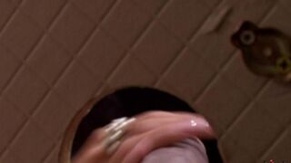 A woman gave a blowjob through a hole in the toilet wall with great pleasure