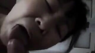 An experienced Chinese woman teaches the guy how to perform a blowjob