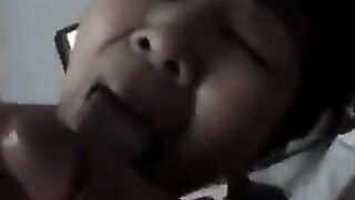 An experienced Chinese woman teaches the guy how to perform a blowjob