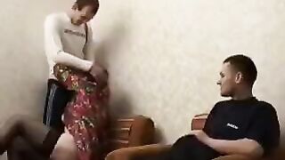 A mature woman fucked with her son and his friend in the hotel room
