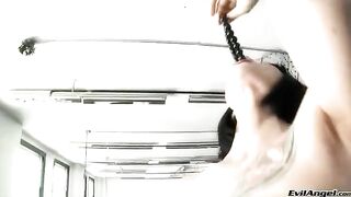 A cute girl plays with balls and puts them in her vagina