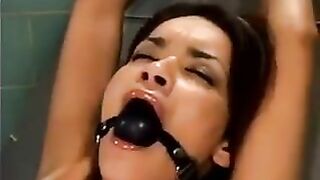 Girl was tied up and fucked by a bald man using a sex machine