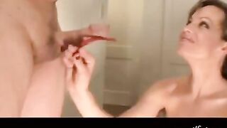 The girl with beautiful breasts skillfully makes a blowjob