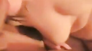 A woman with a big ass spreads her legs to show her shaved pussy