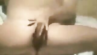 A woman masturbates on the beach and gets caught by a hidden camera