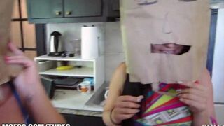Girls put on each other's bags on their heads