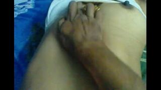 A man massages the tits of his sexy homemade wife