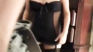 The husband shoots his wife in stockings and corset