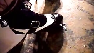 A cutie brunette masturbates her sweet pussy in the toilet