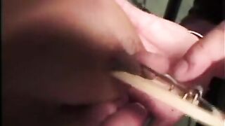 Tied up woman is being hit and humiliated for having big tits