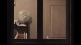He admires himself in the mirror completely naked