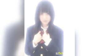 A Japanese schoolgirl masturbates herself in her uniform, showcasing her youthful charm