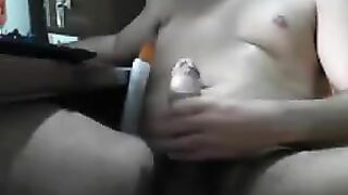 Guy masturbates his cock while sitting in front of the computer
