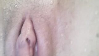 A female orgasm captured in a close-up shot underwater in the pool