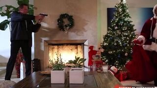 A cheeky girl gets fucked by a man in Santa Claus costumes