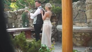 A pair is having fun on their honeymoon outdoors