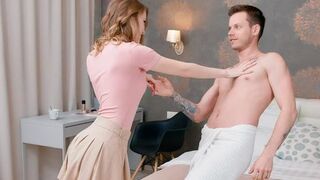 Two naked lovers have a conversation while lying on the bed