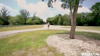 A couple is having fun outdoors in the park without any restrictions