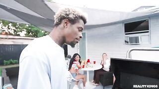 A black guy is fucking a girl at the barbecue party