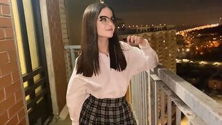A young girl has sex with a guy while seeing the city view